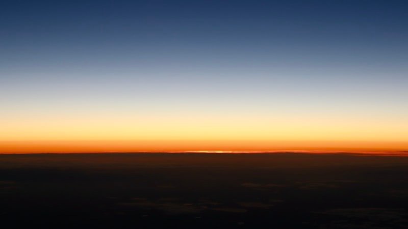 Sunrise over the horizon symbolizing lost optimism about the future in the digital age