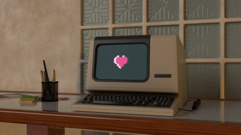 Retro computer with heart on screen representing AIM away messages and early internet communication